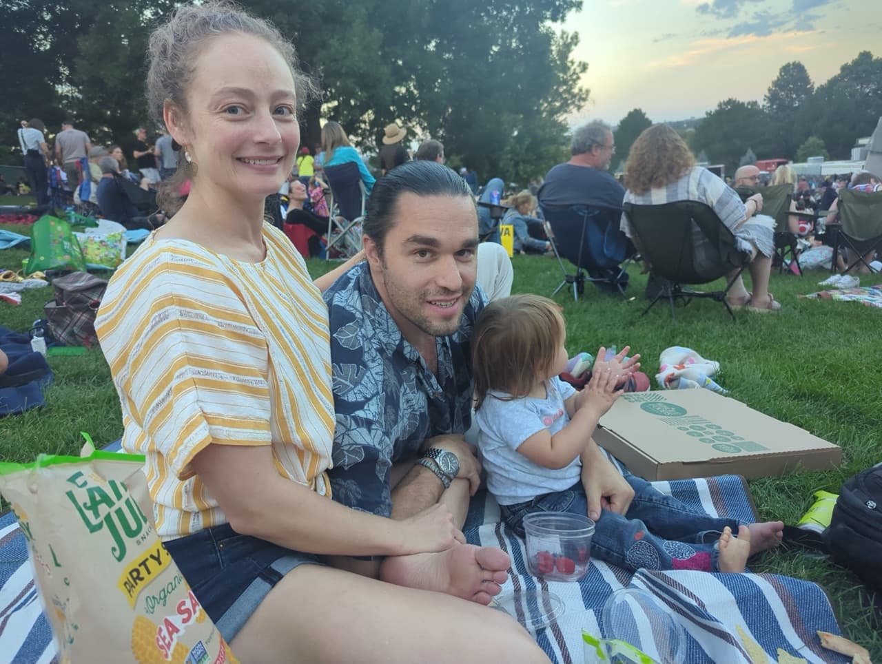 The family behind Stock Up Dinners — outdoor evening picnic, dinner-on-a-blanket.